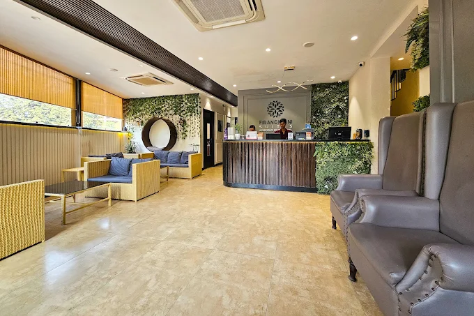 Reception desk and lobby seating at Firangipani Suites in Kolkata